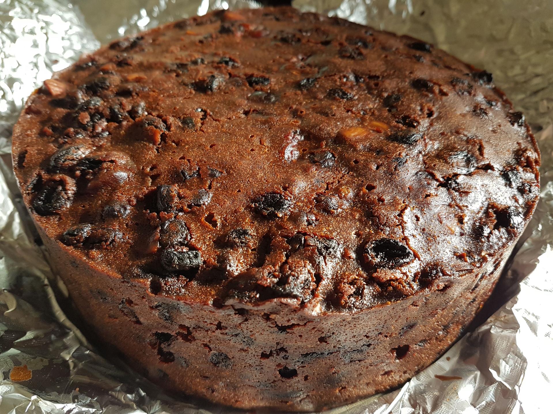 A freshly baked christmas cake waiting for a drink of brandy!