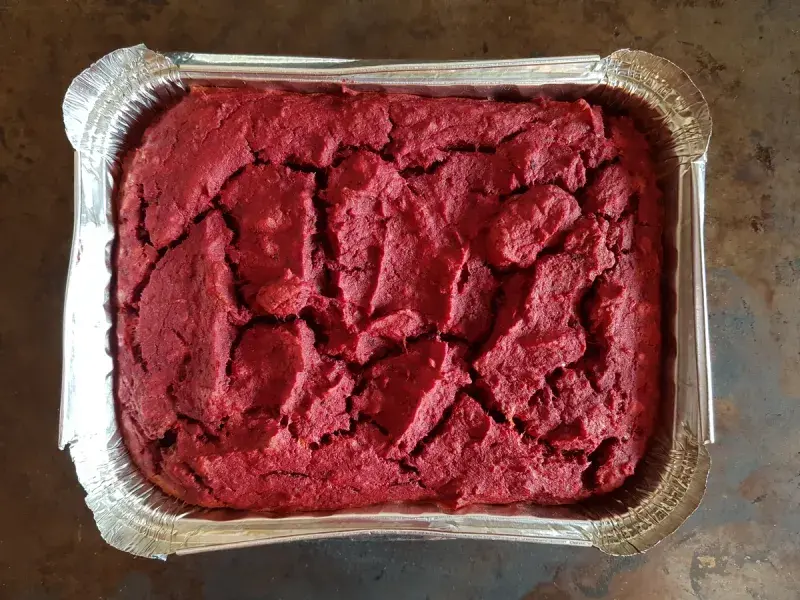 The finished beetroot pate fresh out of the oven in a baking container.